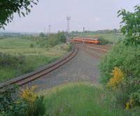 A southbound service passing Swinlees Junction in 1999. The line to the left runs to the Roche Works near Dalry. By the junction is a remaining part of the considerable portion of line which was quadrupled.<br><br>[Ewan Crawford //1999]