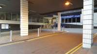 The front taxi rank at Queen Street. A dark and un-enticing location. Above is the 1970s extension to the Millenium Hotel and just ahead is the fanlight glass front of the station roof - obscured by the concrete construction above. Hopefully this will be visible through the proposed new glazed front to the station.<br><br>[Beth Crawford 18/05/2017]