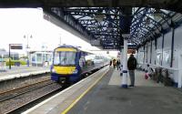 A Glasgow to Alloa service pulls into Stirling on a fine, warm 18/05/2017. Platform 6 is used by most of these trains in both directions. Platform 9 is in regular, though less frequent use, but by the look of it bay Platform 10 (far left) sees little use now; it certainly has no departure screen.<br><br>[David Panton 18/05/2017]