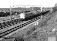 An up WCML express passing the extensive CE sidings at the north end of Carstairs station on 13 September 1981. The train is hauled by 87021 <I>Robert the Bruce</I>.<br><br>[John Furnevel 13/09/1981]