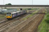 A Manchester Victoria to Blackpool North service is seen at the significantly reduced Kirkham North Jct on 31 May 2017. The former fast lines on the right have been lifted, as have the engineers sidings on the left. In front of the DMUs the line to South Shore can be seen curving to the left. The former route to Blackpool Central was straight ahead of the train, latterly used as the CE tip.<br><br>[John McIntyre 31/05/2017]