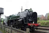 BR Standard 9F 2-10-0 92214 taking water at Loughborough Central on 6th May 2017.<br><br>[Peter Todd 06/05/2017]