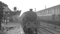 BR Standard class 5 73121 stands alongside Carlisle platform 1 on 14 August 1965 with the summer Saturday 9.25am Blackpool North - Glasgow Central via Dumfries, Kilmarnock and Paisley Gilmour Street.<br><br>[K A Gray 14/08/1965]