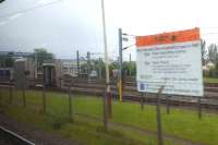 The trainwasher at Yoker Depot. To the right is the announcement of the new Yoker Signalling Centre and Yoker Depot - now a remarkable 30 years old. Whatever that sign is made of, it's pretty durable.<br><br>[Beth Crawford 22/05/2017]