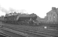 Something of an ex-works look about V2 2-6-2 60886 as it takes a brake van past Newcastle Central on the goods avoiding lines around 1960.<br><br>[K A Gray //1960]