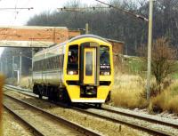 Express Sprinter 158761, probably brand new and on test, runs south on the WCML approaching Woodacre Crossing on 2nd March 1991. These units never saw regular use on this stretch of line, apart from the early years of the Virgin franchise when five sets were used on services between Scotland and Manchester, but in 2018 are being introduced on Barrow to Manchester Airport services. I recall thinking the 158s were a very stylish design when new and they haven't really aged in 26 years.<br><br>[Mark Bartlett 02/03/1991]