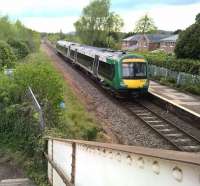 DMU 170509 leaves Colwall on its way to Hereford on 1st May 2017 with a service from Birmingham New Street. The rugged hills are typical of the Malvern area in the background. [Ref query 1053]<br><br>[Ken Strachan 01/05/2017]