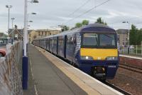 The driver of 320416 looks back as the doors are closed on the 1151 hrs service from Lanark to Glasgow Central on 29 May 2017.<br><br>[John McIntyre 29/05/2017]