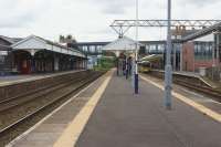 Heavy rail and tram meet at Altrincham. Looking west with the line to Chester on the left and the terminus platforms of the Metrolink trams on the right [See image 50065].<br><br>[John McIntyre 19/05/2017]