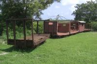 In Antigua, we visited a wee museum that had been created at a place called Betty's Hope, an old sugar plantation, but what really caught my eye was the wee 'train' of wagons arranged in a shallow arc in the grass alongside a restored windmill (no track present). Obviously narrow gauge (approx. 2'-0' I reckon), there were no identifying marks on the wagons, only the word 'Gregg' cast into the axlebox covers and the wagon couplings. Some of the wagons had been 'modified' at some point, as indicated by welding (very poor at that) at various locations thereon.<br><br>[Robert Blane 19/05/2017]