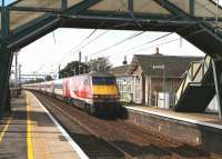 An afternoon Virgin Trains East Coast service runs south through Prestonpans station on 7 September 2016.<br><br>[John Furnevel 07/09/2016]