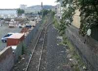 The Powderhall branch looking south east from Powderhall Road towards Leith Walk in the summer of 2004, with the next phase of development about to get underway on the left [see image 13871].<br><br>[John Furnevel /07/2004]