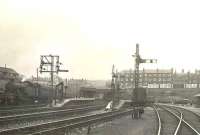 View of Maryhill Central station on 25 July 1951 looking north towards Maryhill Road. Dawsholm shed's Stanier 2-6-2T 40153 stands in the sidings on the left.<br><br>[G H Robin collection by courtesy of the Mitchell Library, Glasgow 25/07/1951]