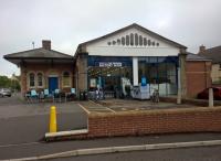 Chard had two stations - the LSWR station has gone, but the GWR station has a new life as a shop. Notice how the arches which were originally on an outside wall of the train shed are now openings into a shop extension. View looks North.<br><br>[Ken Strachan 29/05/2017]