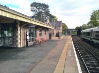 Scene at Malvern Link station, Worcestershire, on 1 May 2017, looking south towards the A449 road bridge. A London Midland Hereford - Birmingham New Street service is at the northbound plaform. [Ref query 1067] Notice the British Rail flag hanging somewhat limply (not Limpley) from the station master's house.<br><br>[Ken Strachan 01/05/2017]