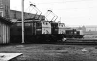 The first BR locomotives to be renumbered under the TOPS scheme were some Class 76 Woodhead electrics. This view at Reddish Depot in 1971 shows E26001, newly renumbered 76037 and also Class 40 221, the former <I>Ivernia</I>. Everything in this scene is now gone with Reddish Depot finally closing in 1983 following which the site was cleared for housing. <br><br>[Mark Bartlett //1971]