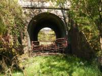 A network of lines spreading west from Glengarnock connected several ironstone pits with the ironworks at Glengarnock but all were worked out by the early twentieth century and so iron ore had to be imported. One tangible reminder of these lines is this substantial bridge which permitted one of these lines to pass under what is now the B780 between Kilbirnie and Dalry. It will be well over 100 years since it last saw a train.<br><br>[Douglas Blades 05/05/2017]