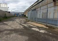 I came across this section of track in Craigton Industrial Estate just East of Cardonald station recently. 1936 OS map appears to show a biscuit works? (Does anyone know about the biscuit works, perhaps part of McDonalds Bakery?)<br>
<br>
The view looks west with the Glasgow-Paisley line behind the building to the right.<br>
<br>
The site became Howden's compressor works from 1947 until 2014. The trackwork was taken out of use around 1960, making this short section an unusual survivor. Access was from a reversing spur behind the camera, a siding from Cardonald station.<br><br>[Martin MacGuire 12/06/2017]