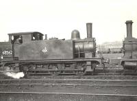 The shed yard at Eastfield on 18 May 1954, with former Great Eastern Railway J69 0-6-0 68562 in steam. This loco emerged from Stratford Works in 1900 and was withdrawn from Polmont in 1956.<br><br>[G H Robin collection by courtesy of the Mitchell Library, Glasgow 18/05/1954]