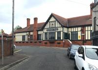 The road approach to Carrickfergus station, from Victoria Street, looking north on 13 June 2017. The NIR station on the Belfast - Larne line dates from 1862 and underwent a major refurbishment in 2001.<br><br>[Andy Furnevel 13/06/2017]