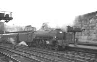The 8.35am Glasgow St Enoch - London St Pancras stands at Carlisle platform 4 on a grey Saturday 7 September 1963. Locomotive in charge is Neville Hill A1 Pacific no 60131 <I>Osprey</I>.<br><br>[K A Gray 07/09/1963]