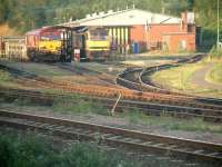 The refuelling point north of Leicester station on a sunny summer evening in August 2002. The locomotives in attendance are EWS 66545 and 60063, the latter carrying the name <I>James Murray</I>.<br><br>[Ian Dinmore 16/08/2002]