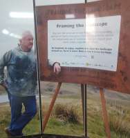 An exhibition of landscapes in the subway at Wakefield Kirkgate station is accompanied by the strains of a band continuously playing Jerusalem.<br><br>[John Yellowlees 10/06/2017]