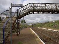 On the way out? Breich Station may be closed to save the costs of replacing the footbridge which is incompatible with electrification work being carried out on the line. In the distance and seemingly within reach of the platform ends is the recently replaced overbridge carrying the A706 over the Shotts line. However, enhanced clearance standards for new overhead wiring would also necessitate relocating the platforms further east at additional cost should the station be retained.<br><br>[Colin McDonald 31/08/2016]