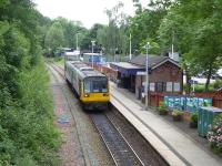 Northern Pacer 142029 rests briefly at Rose Hill (Marple) before returning to Manchester Piccadilly on 16th June 2017. The station surroundings are very green at this time of year compared to the winter months. [See image 41527]<br><br>[Mark Bartlett 16/06/2017]