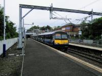 The driver of 320 320 (so good they named it twice) has just changed ends<br>
to continue the journey from Cumbernauld to Dumbarton Central. Changing<br>
ends at Springburn was something diesels did in the past when there was no<br>
direct link between Queen Street High Level and Cumbernauld.<br><br>[David Panton 17/06/2017]