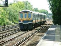 Thameslink unit 319375 runs north through the centre road at Penge West on 12 July 2002 with a service to Bedford. After a many years' service with Thameslink 319375 became a <I>Northern Electric</I> and is now based at Allerton Depot. <br><br>[Ian Dinmore 12/07/2002]