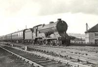 A Perth - Glasgow Queen Street train photographed at Cowlairs West Junction approaching its destination  on 22 July 1957. The locomotive is 'Director' class 4-4-0 no 62689 <I>Maid of Lorn</I>. <br><br>[G H Robin collection by courtesy of the Mitchell Library, Glasgow 22/07/1957]