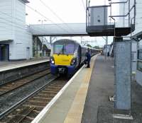 An Edinburgh to Milngavie service changes drivers at Airdrie on 17/06/2017.<br><br>[David Panton 17/06/2017]