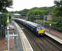 A Milngavie to Edinburgh service makes its first stop, Hillfoot, on<br>
17/06/2017.<br><br>[David Panton 17/06/2017]
