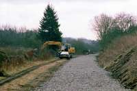 One of the minor mysteries in the history of the Dunblane, Doune and Callander railway is this apparent attempt to relay and re-use part of it during the 1980s. This photo shows how, in March 1988, a stretch of the track bed leading up to the former junction at Dunblane was cleared of vegetation and re-ballasted. It looked as if there was a plan to extend and upgrade the remaining stub of the line (visible in the distance) as a reversal/layover siding for local services clear of the mainline. However, all work stopped shortly after the photo was taken, suggesting that if there was such an intention, it was suddenly abandoned in favour of a timetabling solution.<br><br>[Mark Dufton /03/1988]