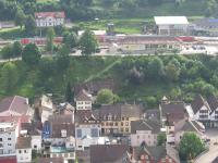 Seen from the top of the local Schloss (castle), a northbound<br>
Schwarzwaldbahn (Black Forest railway) train from Konstanz to Karlsruhe<br>
pauses at Hornberg station on 31st May 2017. The train is a Regional Express (RE)<br>
electric-hauled double-decker push-pull set. The Schwarzwaldbahn runs over a<br>
distance of 149 km from Offenburg (on the Karlsruhe-Basel main line) to<br>
Singen, close to the Swiss border. <br>
<br>
<br><br>[David Spaven 31/05/2017]