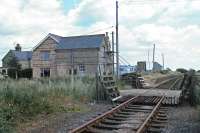 An intermediate station on the Stoke Ferry to Denver branch, Abbey and West Dereham station lost its passenger service as early as September 1930. Goods traffic continued, however, and trains passed through here on behalf of the nearby Wissington sugar refinery until 1982. This scene was recorded on 4th July 1981, shortly before an enthusiasts charter train arrived. Most of the rest of the country was indoors to watch John McEnroe finally defeat Bjorn Borg at Wimbledon.<br><br>[Mark Dufton 04/07/1981]