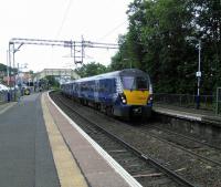 Heralded by the whine and crump of the Westerton Junction points a<br>
Milngavie service calls on 17/06/2017.<br><br>[David Panton 17/06/2017]