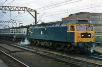 Passengers are in need of the steam heating capability of 47 170 as it pauses at Colchester on 24th January 1976. The boiler is evidently working hard. The service is bound for Ipswich and Norwich.<br><br>[Mark Dufton 24/01/1976]