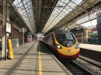 Pendolino 390040 'Virgin Radio Star' on a Glasgow – Euston service starts to roll, if not yet rock, southwards out of Preston.<br><br>[Colin McDonald 20/06/2017]