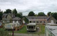 The old station at Middleton-in-Teesdale closed in 1964 and has since become a caravan site with the station building in use as a site office. The static caravans in the foreground occupy the old trackbed with the remains of the platform, station building and station house behind. 26th June 2017. <br><br>[Mark Bartlett 26/06/2017]