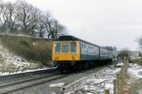 A Class 107 DMU, Glasgow - bound at Beith North in 1986. At least the first car is a 107 - by this time the dmus were on their last legs and some weird and wonderful lash-ups were in use.<br>
<br><br>[Colin Miller //1986]