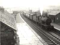 Stranraer based Fowler 2P 4-4-0 no 40623 pulls into the westbound platform of New Galloway station on an overcast Saturday 14 July 1956 with a Dumfries - Stranraer stopping train.<br><br>[G H Robin collection by courtesy of the Mitchell Library, Glasgow 14/07/1956]