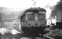 A westbound Aberdeen - Inverness Swindon Cross Country 3 car DMU approaching Boat of Kintore level crossing in April 1977. [Ref query 1087]<br><br>[John McIntyre /04/1977]