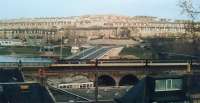 This is a push pull class 47 on the 20th April 1987,  don't remember if leaving or arriving! The River Dee is in the background, the suspension bridge was opened in 1830, the road bridge was only 6 years old.<br><br>[Alan Cormack 20/04/1987]