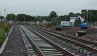 The new station site is progressing well, platforms are nearly complete, the footbridge is being erected and track laid. This view looks east, with the signal box on the right.<br><br>[Alan Cormack 07/07/2017]