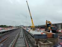 The new station site is progressing well, platforms are nearly complete, the footbridge is being erected and track laid. This view looks west.<br><br>[Alan Cormack 07/07/2017]