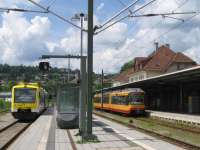 A Karlsruhe tram-train (on the right) has reached its terminus at<br>
Freudenstadt Hauptbahnhof on 3rd June 2017. On the left is a<br>
Freudenstadt-Offenburg local service - formed of two Regio Shuttle<br>
single-unit railcars - operated by franchised private operator SWEG. [With<br>
thanks to Bill Jamieson for loco intelligence]<br>
<br><br>[David Spaven 03/06/2017]