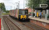 Metro 4082 leads a 4-car Airport to South Hylton service over the level crossing and into Bank Foot metro station. Bank Foot is built on the site of Kenton Bank (NER)station, which closed as early as 1929. The old Kenton Bank station has a page on the Disused Stations website.<br><br>[Mark Bartlett 26/06/2017]