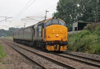 37403 <I>Isle of Mull</I> (ex D6607) powers towards Lancaster with the 2C47 Preston to Barrow service seen at Woodacre on 30th June 2017. The contract with DRS for provision of two Class 37/4 sets on Cumbrian Coast services expires in January 2019.<br><br>[Mark Bartlett 30/06/2017]